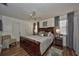 A spacious main bedroom boasts hardwood floors, ceiling fan, and modern décor at 12532 115Th St, Largo, FL 33778