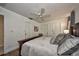 View of main bedroom featuring a ceiling fan, and three interior doors at 12532 115Th St, Largo, FL 33778