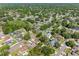 Beautiful aerial view shows residential homes, well-manicured lawns and tree-lined streets at 15307 Summerwind Dr, Tampa, FL 33624