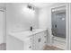 Modern bathroom with quartz countertop vanity, black fixtures, and a glass enclosed shower at 15307 Summerwind Dr, Tampa, FL 33624