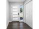 Bright entryway with a modern front door featuring horizontal glass panels and wood-look flooring at 15307 Summerwind Dr, Tampa, FL 33624