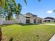 Beautiful home with neat lawn and modern door, perfect for those seeking style and convenience at 15307 Summerwind Dr, Tampa, FL 33624