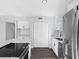 Bright kitchen with quartz countertops, stainless steel appliances, and white cabinets at 15307 Summerwind Dr, Tampa, FL 33624
