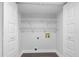 Laundry room or closet featuring white doors and shelving at 15307 Summerwind Dr, Tampa, FL 33624