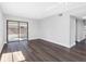 Bright living area with wood floors and sliding glass doors to a covered patio at 15307 Summerwind Dr, Tampa, FL 33624
