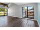 Bright and airy living room with neutral walls, laminate floors, and large windows, freshly painted at 15307 Summerwind Dr, Tampa, FL 33624