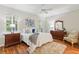 Cozy bedroom with plush rug, wood floors, and serene decor at 15324 Sherwood Forest Dr, Tampa, FL 33647