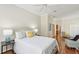 Spacious bedroom with hardwood floors features a neutral color palette and access to other rooms at 15324 Sherwood Forest Dr, Tampa, FL 33647