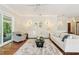 Bright living room with hardwood floors, plush rug, and neutral decor at 15324 Sherwood Forest Dr, Tampa, FL 33647