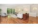 Spacious living room with hardwood floors, neutral walls, slider doors and a view of the screened porch at 15324 Sherwood Forest Dr, Tampa, FL 33647