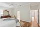 Spacious main bedroom with hardwood floors leading to ensuite at 15324 Sherwood Forest Dr, Tampa, FL 33647