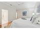 Bright main bedroom features hardwood floors, a ceiling fan, and ensuite bathroom at 15324 Sherwood Forest Dr, Tampa, FL 33647