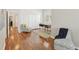 Hardwood floored office area with modern desk and seating near bright windows and closets at 15324 Sherwood Forest Dr, Tampa, FL 33647