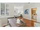 Office view into the bedroom and bath, featuring hardwood floors, and large windows at 15324 Sherwood Forest Dr, Tampa, FL 33647