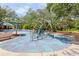 Community playground featuring modern equipment, benches, and shade structures for outdoor enjoyment at 15324 Sherwood Forest Dr, Tampa, FL 33647