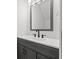 Modern bathroom with sleek vanity, framed mirror, and contemporary fixtures at 16512 Brigadoon Dr, Tampa, FL 33618