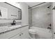 Updated bathroom with granite vanity, tiled shower, and modern fixtures, offering a fresh clean design at 16512 Brigadoon Dr, Tampa, FL 33618
