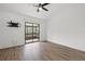 Light-filled bedroom offers sliding glass doors to screened lanai and ceiling fan at 16512 Brigadoon Dr, Tampa, FL 33618