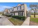 Inviting townhouse showcasing manicured hedges and a well-kept lawn at 16512 Brigadoon Dr, Tampa, FL 33618