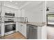 Bright kitchen with stainless steel appliances and granite countertops at 16512 Brigadoon Dr, Tampa, FL 33618