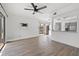 Bright living room featuring modern flooring and access to the backyard at 16512 Brigadoon Dr, Tampa, FL 33618