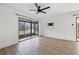 Open living room with hardwood floors and a view of the screened patio at 16512 Brigadoon Dr, Tampa, FL 33618