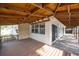 Spacious wooden patio with a wooden ceiling, offering a seamless transition to the backyard at 1820 Massachusetts Ne Ave, St Petersburg, FL 33703