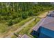 Aerial view of the home's backyard featuring a white picket fence at 19204 Briarbrook Dr, Tampa, FL 33647