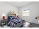 Bright bedroom with a window and beach themed decor at 19204 Briarbrook Dr, Tampa, FL 33647