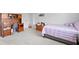 Comfortable bedroom featuring a desk, soft carpet, and a plush twin bed at 19204 Briarbrook Dr, Tampa, FL 33647