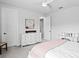 Well-lit bedroom with stylish white furniture, carpeted floors, and ample closet space at 19204 Briarbrook Dr, Tampa, FL 33647