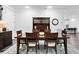 An open concept dining room featuring a wooden table set and hardwood floors at 19204 Briarbrook Dr, Tampa, FL 33647