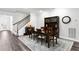 An open concept dining room featuring a wooden table set and hardwood floors at 19204 Briarbrook Dr, Tampa, FL 33647