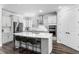 Beautiful kitchen with white cabinets, stainless steel appliances, and a large center island with seating at 19204 Briarbrook Dr, Tampa, FL 33647