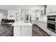 Spacious kitchen featuring a large island with seating, modern appliances, and ample counter space at 19204 Briarbrook Dr, Tampa, FL 33647