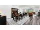 Open concept living space and dining room with hardwood floors and modern furnishings at 19204 Briarbrook Dr, Tampa, FL 33647