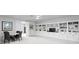 Open-concept living room with custom built-in shelving and a dining area at 19204 Briarbrook Dr, Tampa, FL 33647