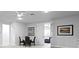 Open-concept living room with custom built-in shelving and a dining area at 19204 Briarbrook Dr, Tampa, FL 33647