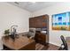 Office space with custom built-in shelving and dark wood floors at 19204 Briarbrook Dr, Tampa, FL 33647