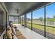 Spacious screened-in patio provides a relaxing space to enjoy backyard views at 19204 Briarbrook Dr, Tampa, FL 33647