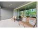 Covered patio with comfortable seating and a lovely view of the fenced backyard at 19204 Briarbrook Dr, Tampa, FL 33647