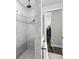 Contemporary bathroom showcasing gray tiled shower with dual showerheads and a separate closet at 19204 Briarbrook Dr, Tampa, FL 33647