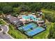 The community boasts tennis courts adjacent to the clubhouse and pool, framed by verdant landscaping and mature trees at 19204 Briarbrook Dr, Tampa, FL 33647