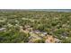 Gorgeous aerial view of home and neighborhood with mature landscaping at 1974 N Betty Ln, Clearwater, FL 33755
