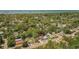 Overhead view of a residential area featuring houses nestled among trees and close to the water at 1974 N Betty Ln, Clearwater, FL 33755