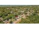 Expansive aerial view of a neighborhood with homes and abundant greenery in a coastal community at 1974 N Betty Ln, Clearwater, FL 33755