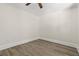 Minimalist bedroom featuring natural light, laminate flooring, and clean, simple design at 1974 N Betty Ln, Clearwater, FL 33755