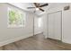 Spacious bedroom offering natural light, closet and ceiling fan, perfect for relaxation and rest at 1974 N Betty Ln, Clearwater, FL 33755