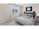 Comfortable bedroom with moon themed decor and lots of natural light at 2250 Rikkola Ln, Wesley Chapel, FL 33543
