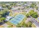 Community featuring tennis courts, a pond with a gazebo, lush landscaping, and amenities that promote an active lifestyle at 2310 Denmark St # 30, Clearwater, FL 33763